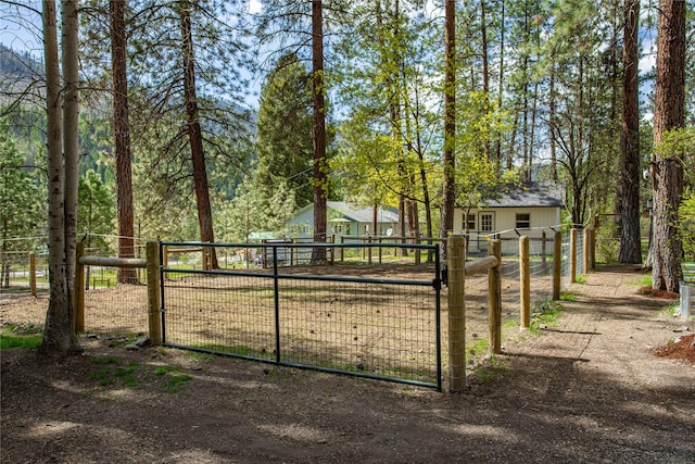 view of gate with fence