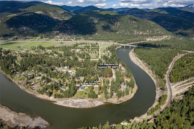 drone / aerial view with a water and mountain view