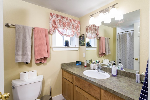 111 6th Ave W, Polson, MT 59860 - full bath with vanity, a shower with curtain, and toilet