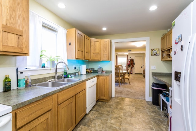 111 6th Ave W, Polson, MT 59860 - kitchen with plenty of natural light, a sink, carpet flooring, and white appliances