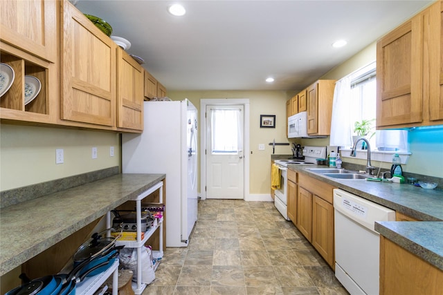 111 6th Ave W, Polson, MT 59860 - kitchen featuring white appliances, recessed lighting, a healthy amount of sunlight, and a sink