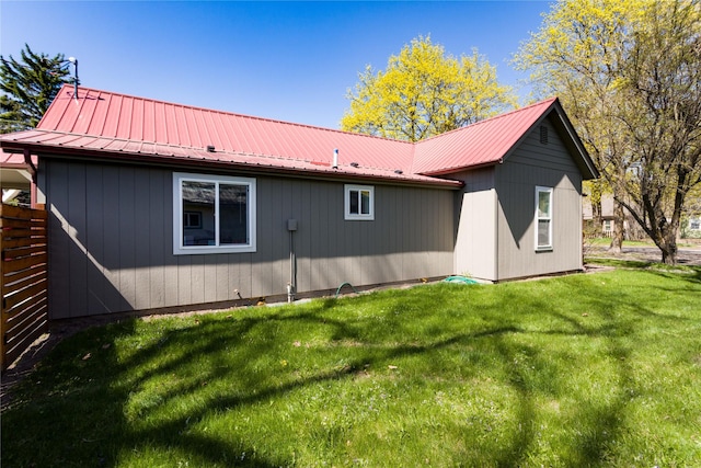 111 6th Ave W, Polson, MT 59860 - rear view of property with a lawn and metal roof