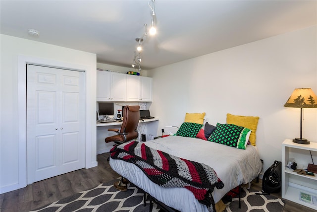 111 6th Ave W, Polson, MT 59860 - bedroom featuring a closet, built in desk, and wood finished floors