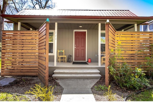 111 6th Ave W, Polson, MT 59860 - view of exterior entry with covered porch and metal roof