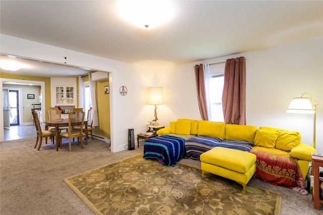 111 6th Ave W, Polson, MT 59860 - living area featuring carpet and a baseboard heating unit