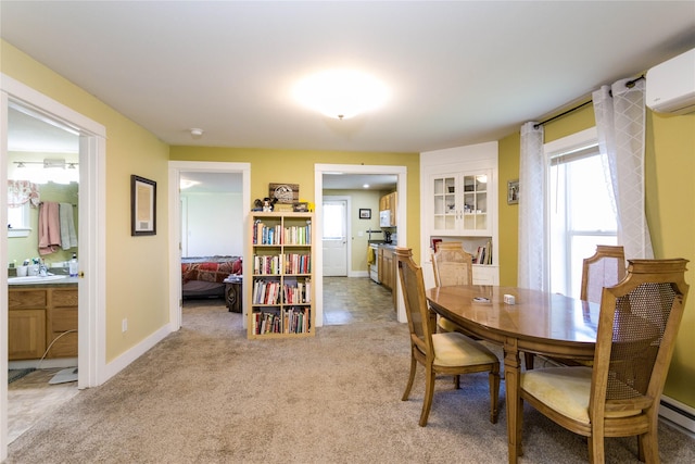 111 6th Ave W, Polson, MT 59860 - dining area with baseboards, light colored carpet, and a wall mounted air conditioner