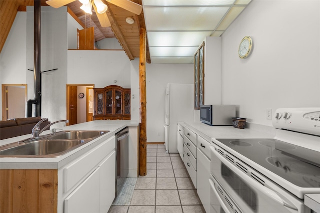 290 Browns Meadow Rd, Kila, MT 59920 - kitchen featuring white cabinets, ceiling fan, a sink, light countertops, and stainless steel appliances