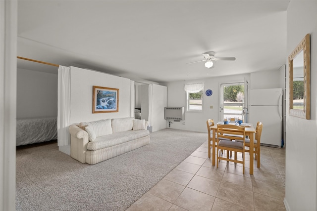 290 Browns Meadow Rd, Kila, MT 59920 - living room featuring ceiling fan, heating unit, light carpet, and light tile patterned floors