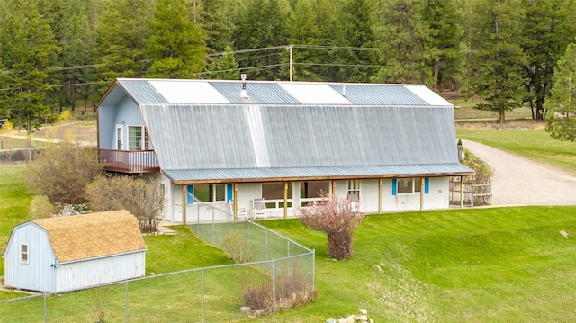 290 Browns Meadow Rd, Kila, MT 59920 - back of property featuring a storage unit, an outbuilding, a gambrel roof, and metal roof