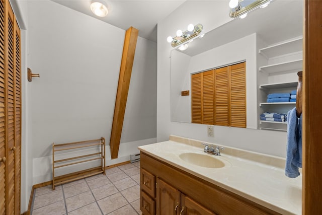 290 Browns Meadow Rd, Kila, MT 59920 - bathroom featuring a closet, tile patterned floors, baseboard heating, and vanity