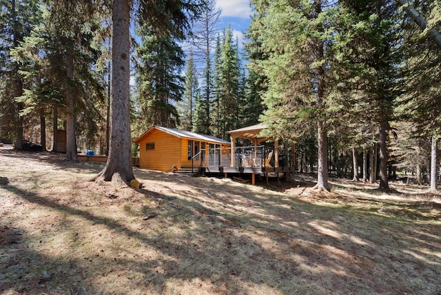 back of property with a deck
