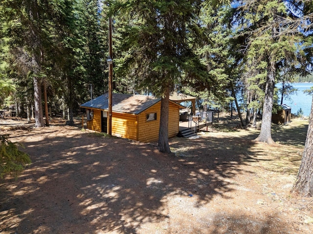 view of property exterior featuring log veneer siding