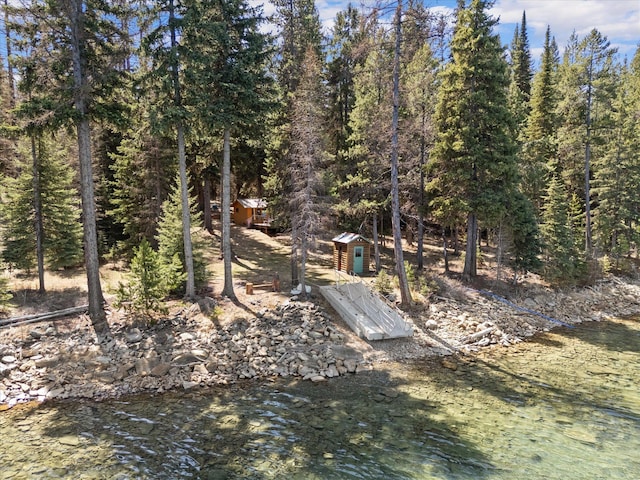 560 Mcgregor Ln, Marion, MT 59925 - view of yard featuring a storage shed and an outdoor structure