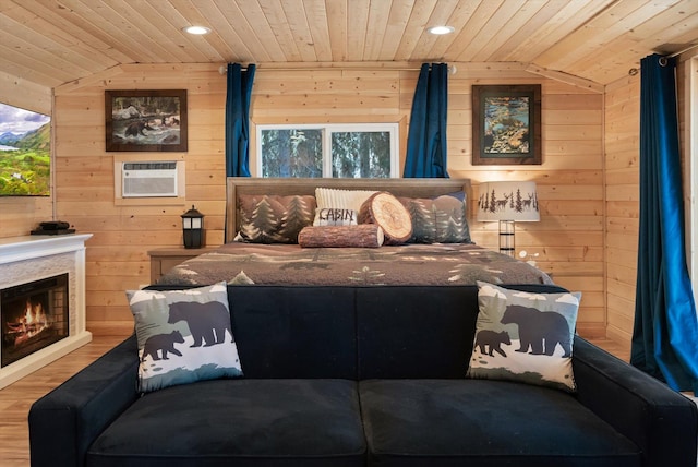 560 Mcgregor Ln, Marion, MT 59925 - bedroom with wooden ceiling, wooden walls, recessed lighting, wood finished floors, and a wall mounted AC