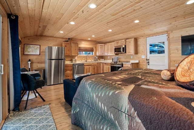 bedroom featuring a sink, freestanding refrigerator, and recessed lighting