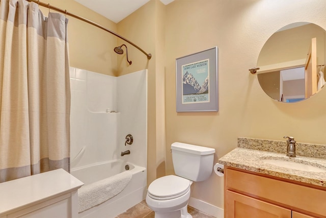 full bath with shower / bath combo with shower curtain, vanity, toilet, baseboards, and tile patterned floors