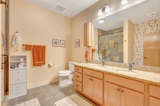 bathroom with visible vents, baseboards, tile patterned floors, a shower stall, and a sink