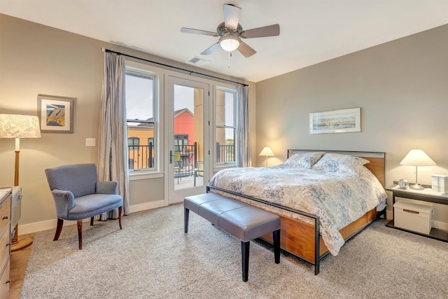 bedroom featuring ceiling fan, visible vents, baseboards, access to outside, and carpet flooring