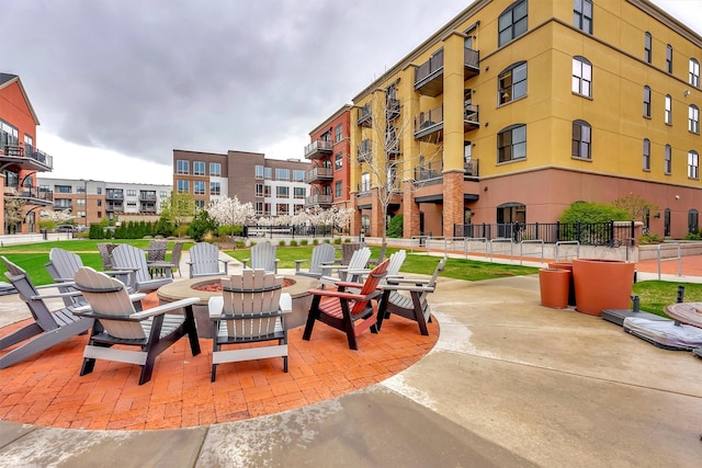 view of patio / terrace featuring an outdoor fire pit and fence
