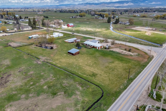 birds eye view of property with a mountain view and a rural view