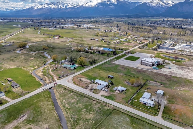 birds eye view of property featuring a mountain view
