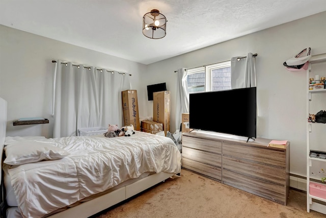 bedroom featuring light carpet