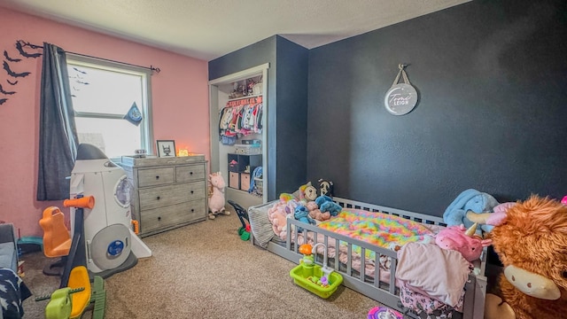 bedroom featuring carpet floors and a textured ceiling