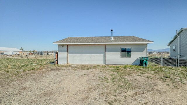 detached garage with fence