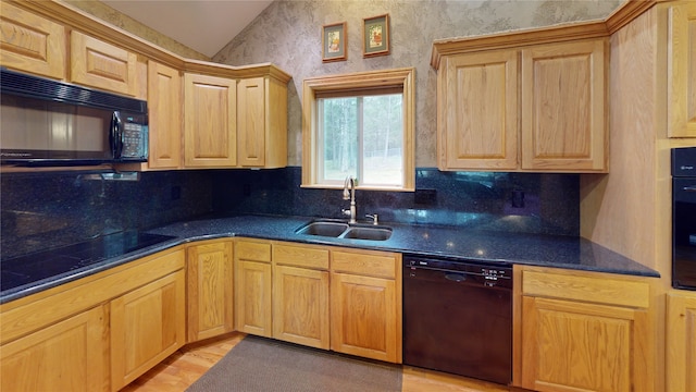261 Green Briar Trl, Eureka, MT 59917 - kitchen featuring a sink, vaulted ceiling, black appliances, and dark countertops