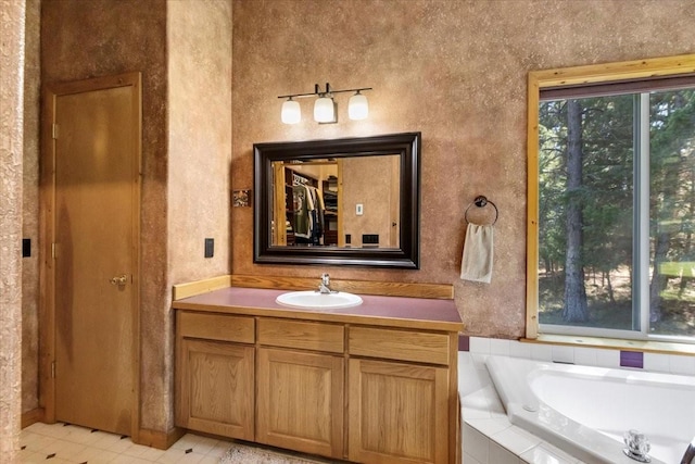 261 Green Briar Trl, Eureka, MT 59917 - full bath with vanity, a closet, and tiled tub