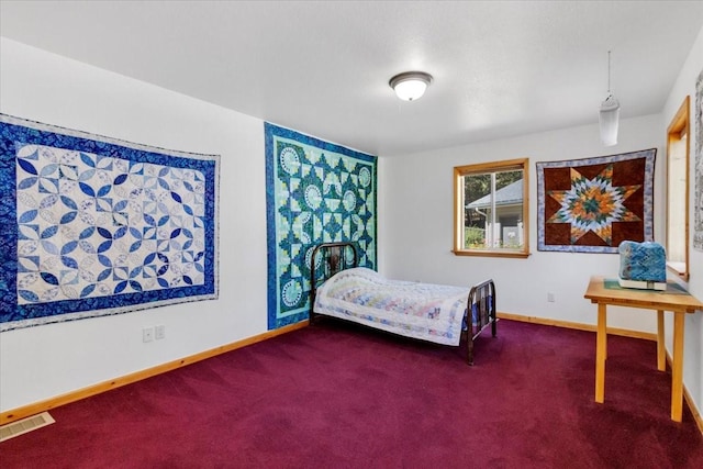 261 Green Briar Trl, Eureka, MT 59917 - bedroom featuring baseboards, visible vents, and dark carpet