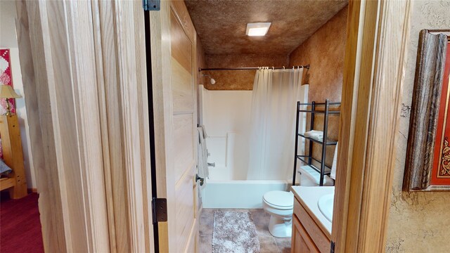 261 Green Briar Trl, Eureka, MT 59917 - bathroom featuring vanity, shower / bath combo with shower curtain, and toilet