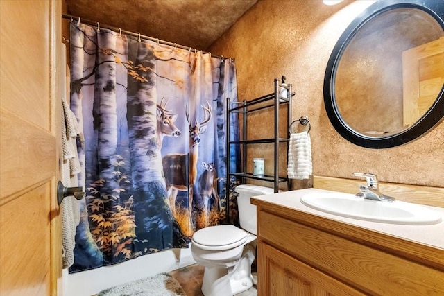 261 Green Briar Trl, Eureka, MT 59917 - full bath featuring vanity, tile patterned flooring, a textured wall, toilet, and a shower with shower curtain