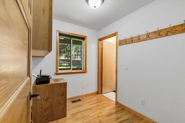 261 Green Briar Trl, Eureka, MT 59917 - interior space with baseboards, light wood finished floors, and visible vents