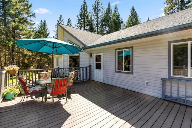 261 Green Briar Trl, Eureka, MT 59917 - wooden deck featuring outdoor dining area