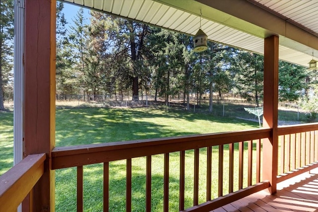 261 Green Briar Trl, Eureka, MT 59917 - wooden deck featuring a fenced backyard and a yard