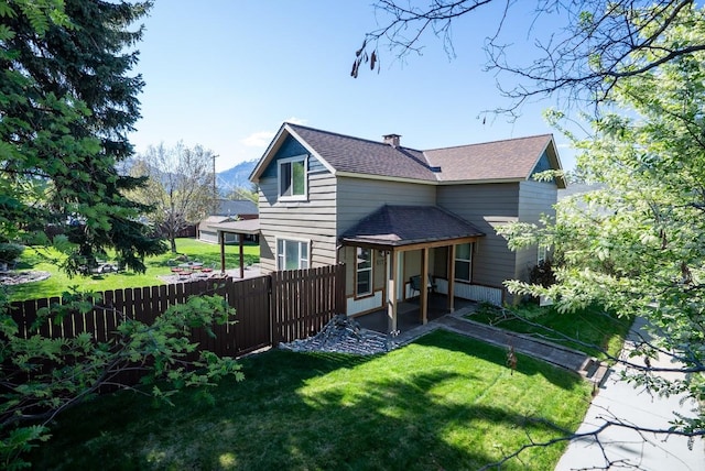 617 N 5th St, Hamilton, MT 59840 - view of front of house with a chimney and roof with shingles