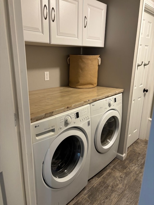 laundry area with cabinet space, dark wood-style floors, and independent washer and dryer