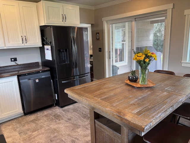 kitchen featuring ornamental molding, dishwasher, dark countertops, and fridge with ice dispenser