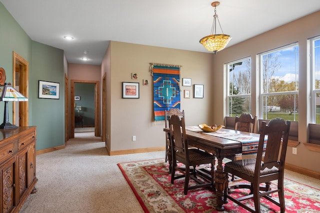 dining area with recessed lighting, baseboards, and light colored carpet