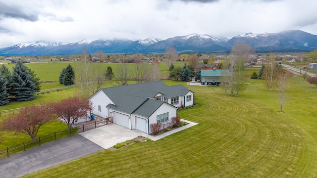 birds eye view of property with a mountain view and a rural view