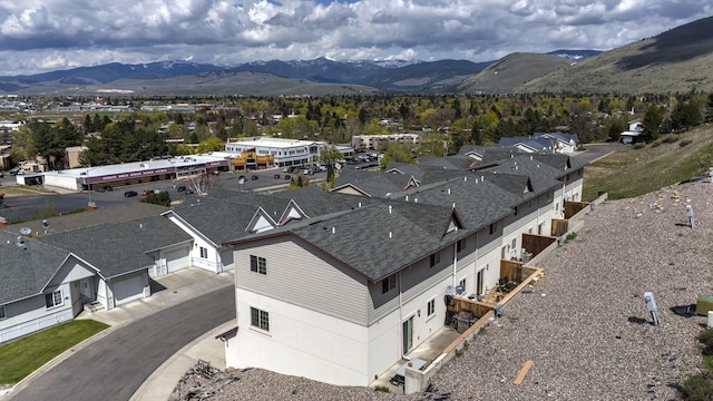 birds eye view of property featuring a mountain view