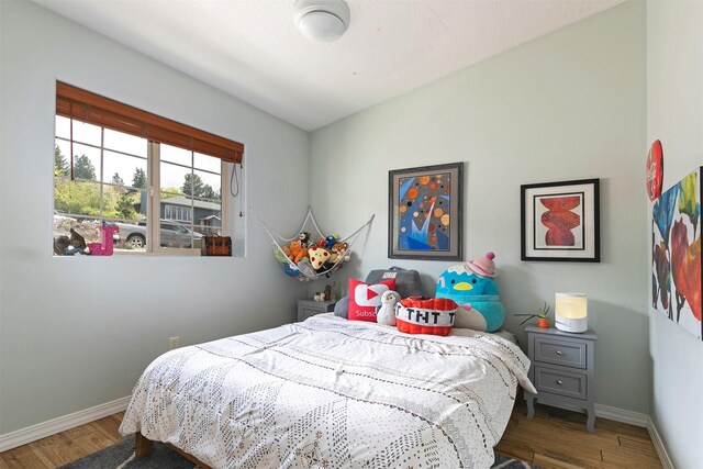 825 Crestmont Way, Missoula, MT 59803 - bedroom featuring wood finished floors, baseboards, lofted ceiling, and a ceiling fan