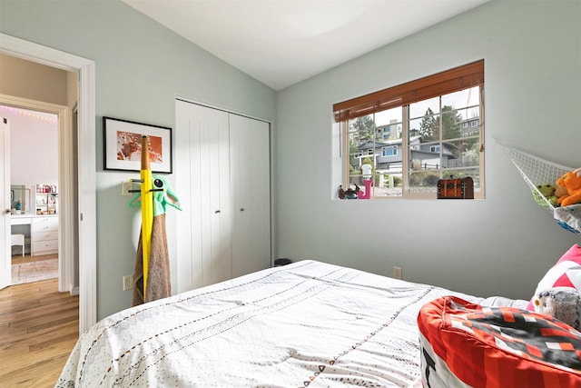 bedroom with a closet and wood finished floors