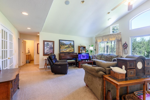 living room featuring ceiling fan, baseboards, high vaulted ceiling, carpet, and recessed lighting