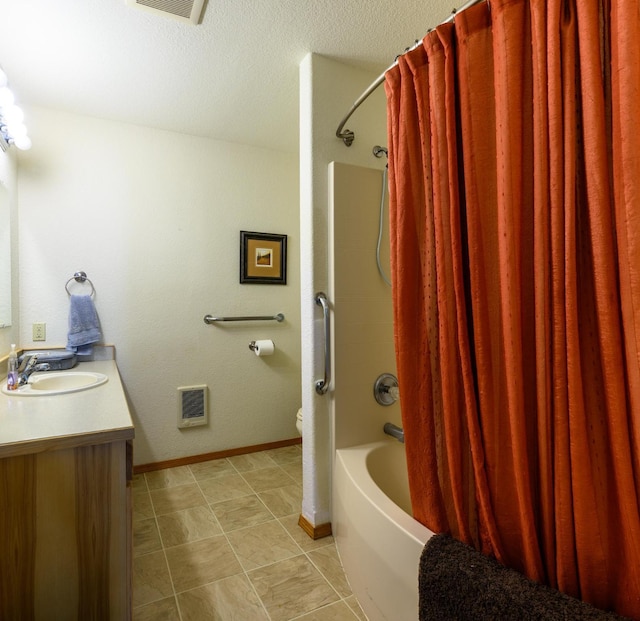 bathroom with vanity, shower / bath combo with shower curtain, heating unit, toilet, and baseboards