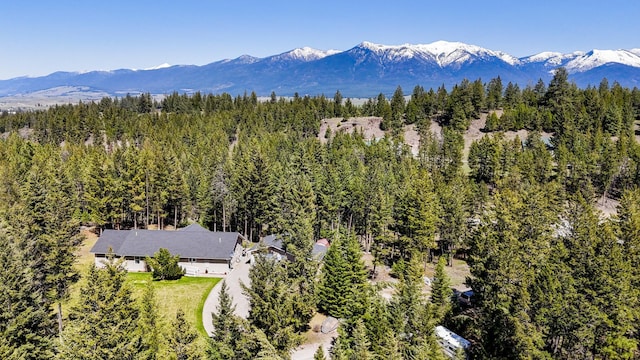 bird's eye view with a wooded view and a mountain view