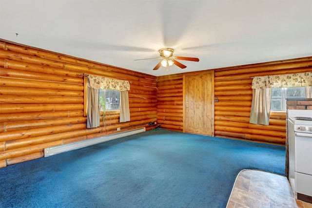 spare room featuring carpet floors, ceiling fan, baseboard heating, and a healthy amount of sunlight