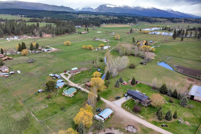 birds eye view of property with a rural view and a water and mountain view