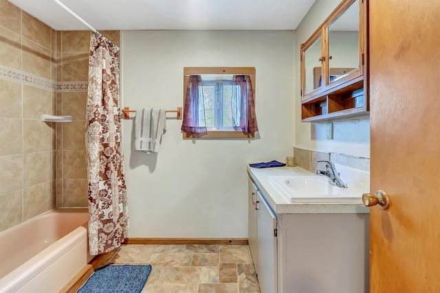 full bath with baseboards, shower / tub combo with curtain, and vanity